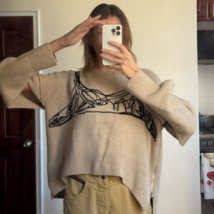 Carol Chugani cashmere sweater with fashionable icon design